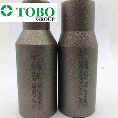 Acero de aleación forjado del titanio de las instalaciones de tuberías ASTM B861 GR2 2" x 1" entrerrosca del macho de estampar de la aleación del titanio de SCH10S x SCH40S